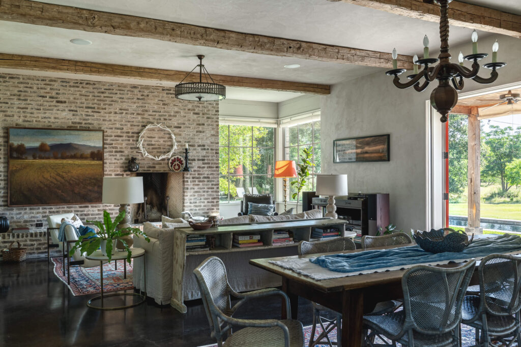 A beautifully textured clay plaster ceiling contrasted with rustic wooden beams in a Texas Hill Country home.