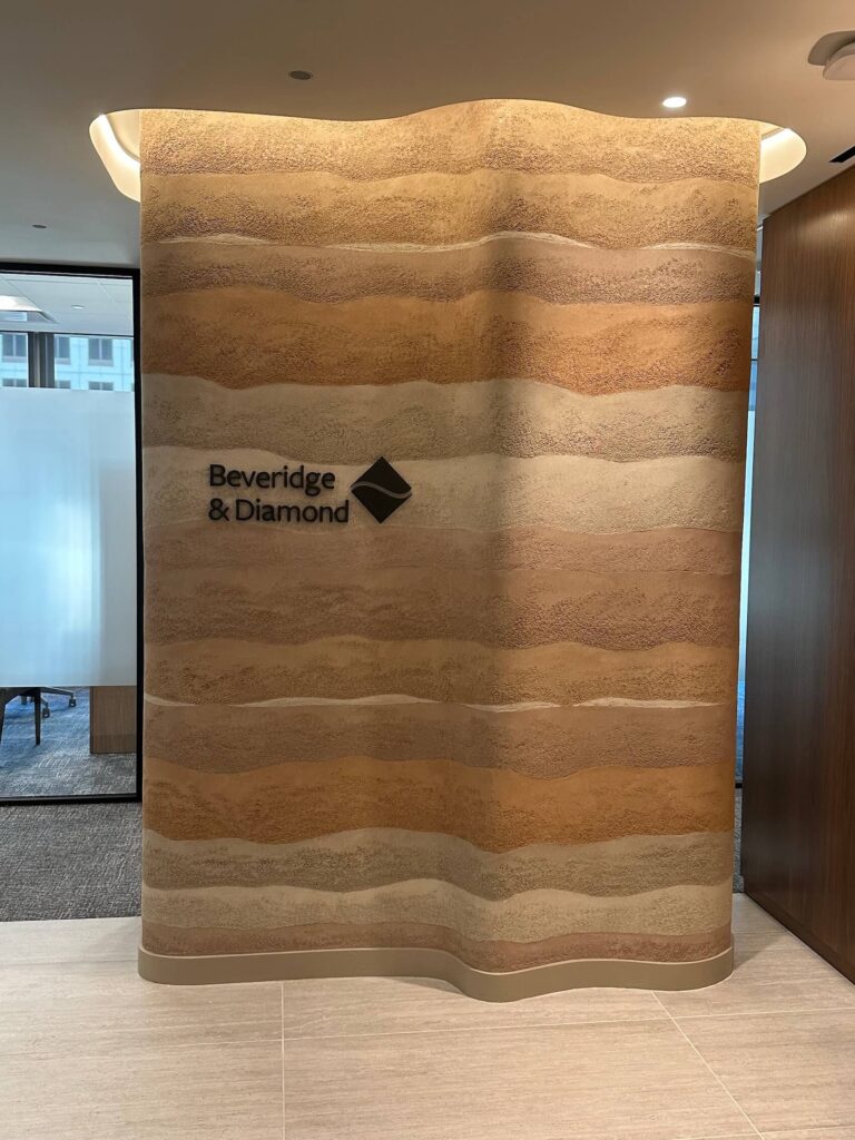 Clayworks rammed earth plaster finish on a feature wall inside a luxury downtown Austin corporate executive suite.