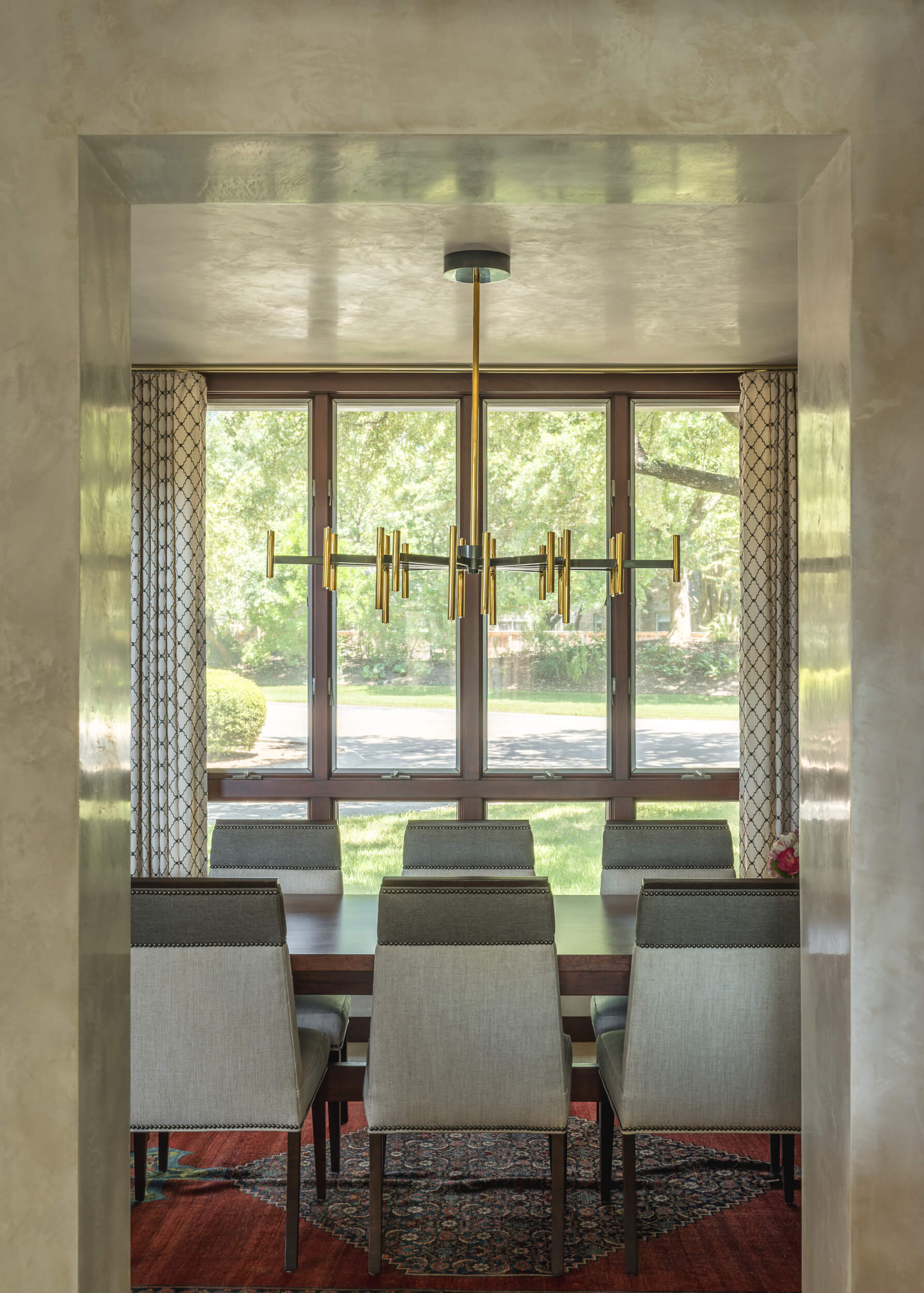 Custom hand troweled two-toned polished Marmorino plaster on dining room walls and ceiling in an Austin Texas home.